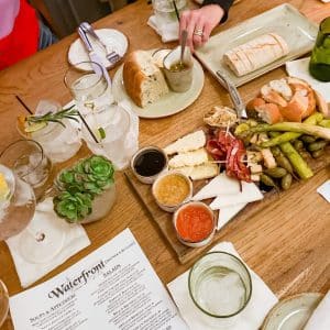 Dinner Party on Anna Maria at The Waterfront Restaurant image of a table and appetizers and the menu