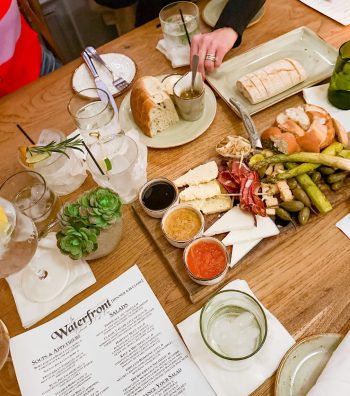 Dinner Party on Anna Maria at The Waterfront Restaurant image of a table and appetizers and the menu